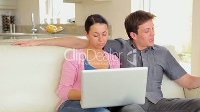 Man and woman shopping online