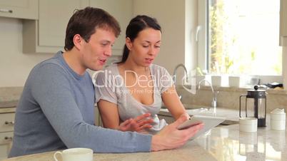 Couple using tablet pc together