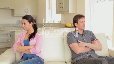 Couple not talking with arms crossed