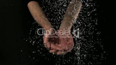 Man washing hands under water
