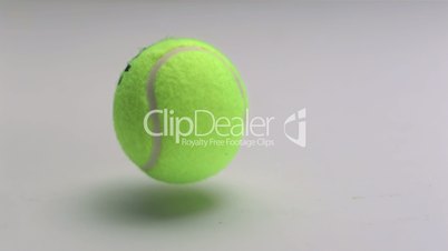 Tennis ball bouncing on the floor