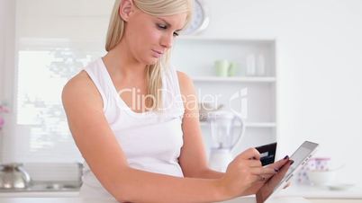 Woman shopping online with tablet computer