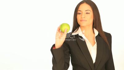 Businesswoman holding a fresh apple