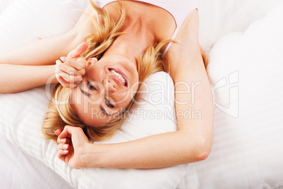 Woman relaxing in bed