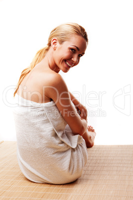 Smiling woman in a bath towel