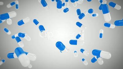 Falling white and blue pills