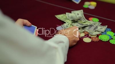 Dealer dealing cards for poker