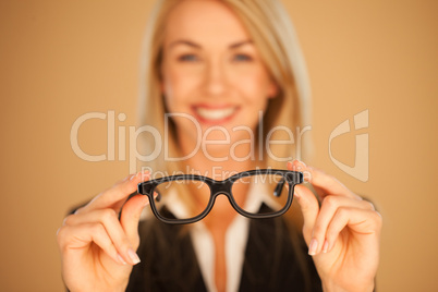 Woman holding out her spectacles