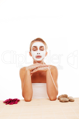 Woman meditating in a face mask