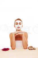 Woman meditating in a face mask