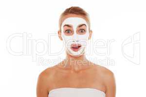 Woman in face mask with surprised expression