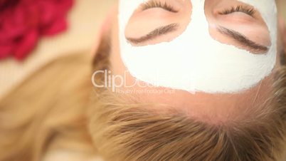 Face mask on blonde woman