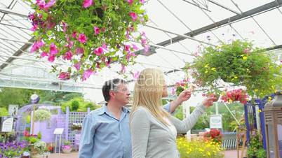 Couple looking at hanging basket