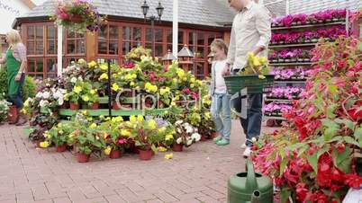 Man and child buying flowers