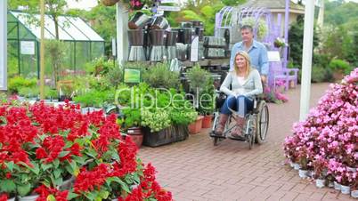 Couple looking at flowers at the garden centre
