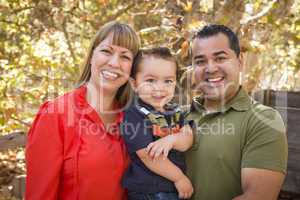 Happy Mixed Race Family Posing for A Portrait
