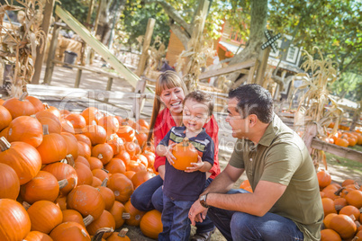 Happy Mixed Race Family at the Pumpkin Patch