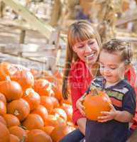 Happy Mixed Race Family at the Pumpkin Patch