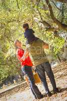 Mixed Race Family Enjoy a Walk in the Park