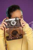 Woman using a vintage camera