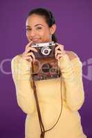 Happy photographer with vintage camera