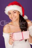 Beautiful woman giving a Christmas gift