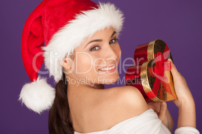 Teasing woman with a Christmas gift