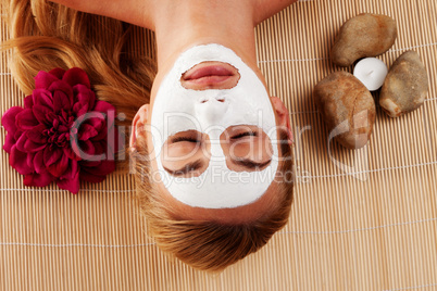 Relaxed woman with a face mask