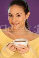 Beautiful woman enjoying a cup of coffee