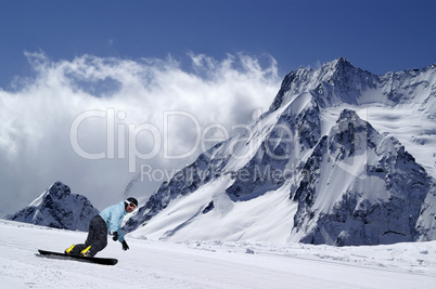 Snowboarder on piste slope