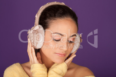 Elegant woman wearing ear muffs