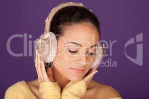 Elegant woman wearing ear muffs
