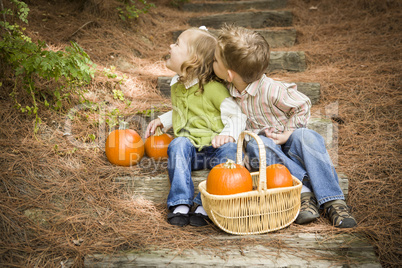Brother and Sister Children on Wood Steps with Pumpkins Playing