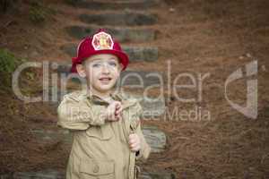 Adorable Child Boy with Fireman Hat Playing Outside
