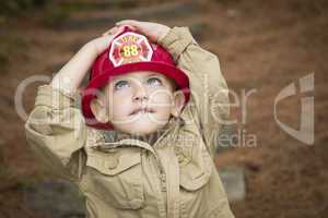 Adorable Child Boy with Fireman Hat Playing Outside