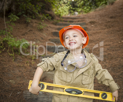 Adorable Child Boy with Level Playing Handyman Outside