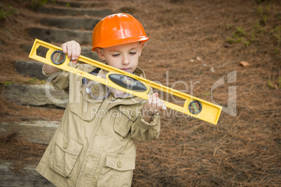 Adorable Child Boy with Level Playing Handyman Outside