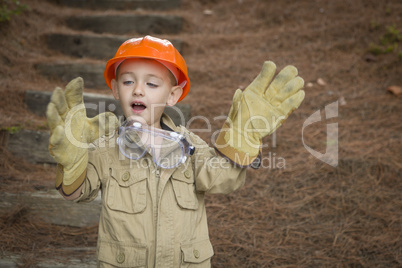 Adorable Child Boy with Big Gloves Playing Handyman Outside