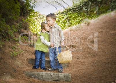 Two Children with Basket Hugging Outside on Steps