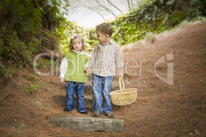 Two Children Walking Down Wood Steps with Basket Outside.