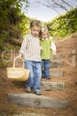 Two Children Walking Down Wood Steps with Basket Outside.