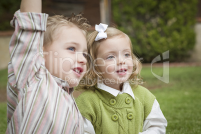 Adorable Brother and Sister Children Playing Outside