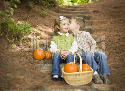 Brother and Sister Children on Wood Steps with Pumpkins Whisperi