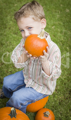 Cure Young Child Boy Enjoying the Pumpkin Patch.