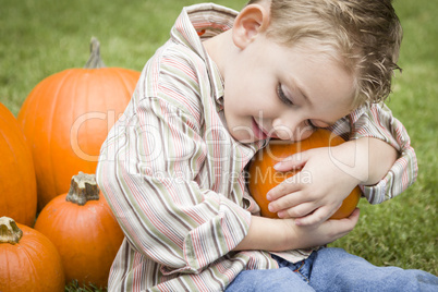 Cure Young Child Boy Enjoying the Pumpkin Patch.