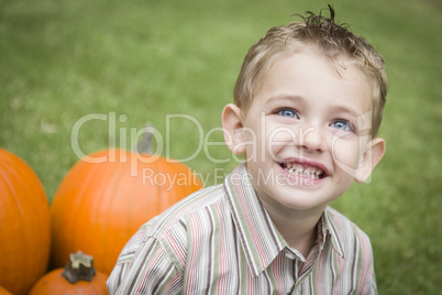 Cure Young Child Boy Enjoying the Pumpkin Patch.