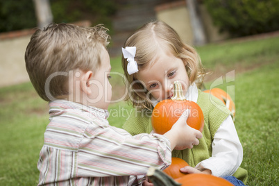 Cute Young Brother and Sister At the Pumpkin Patch