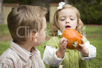 Cute Young Brother and Sister At the Pumpkin Patch