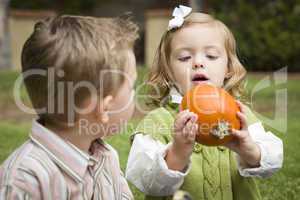 Cute Young Brother and Sister At the Pumpkin Patch