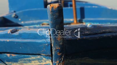 Close up of a docked blue fishing boat
